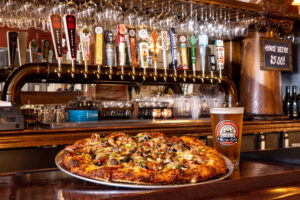 Pizza on a bar.